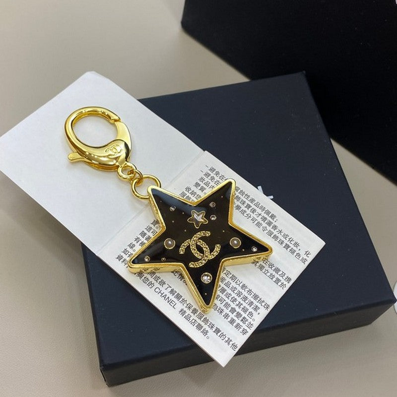 18K  Chanel Black Gold Star Brooch